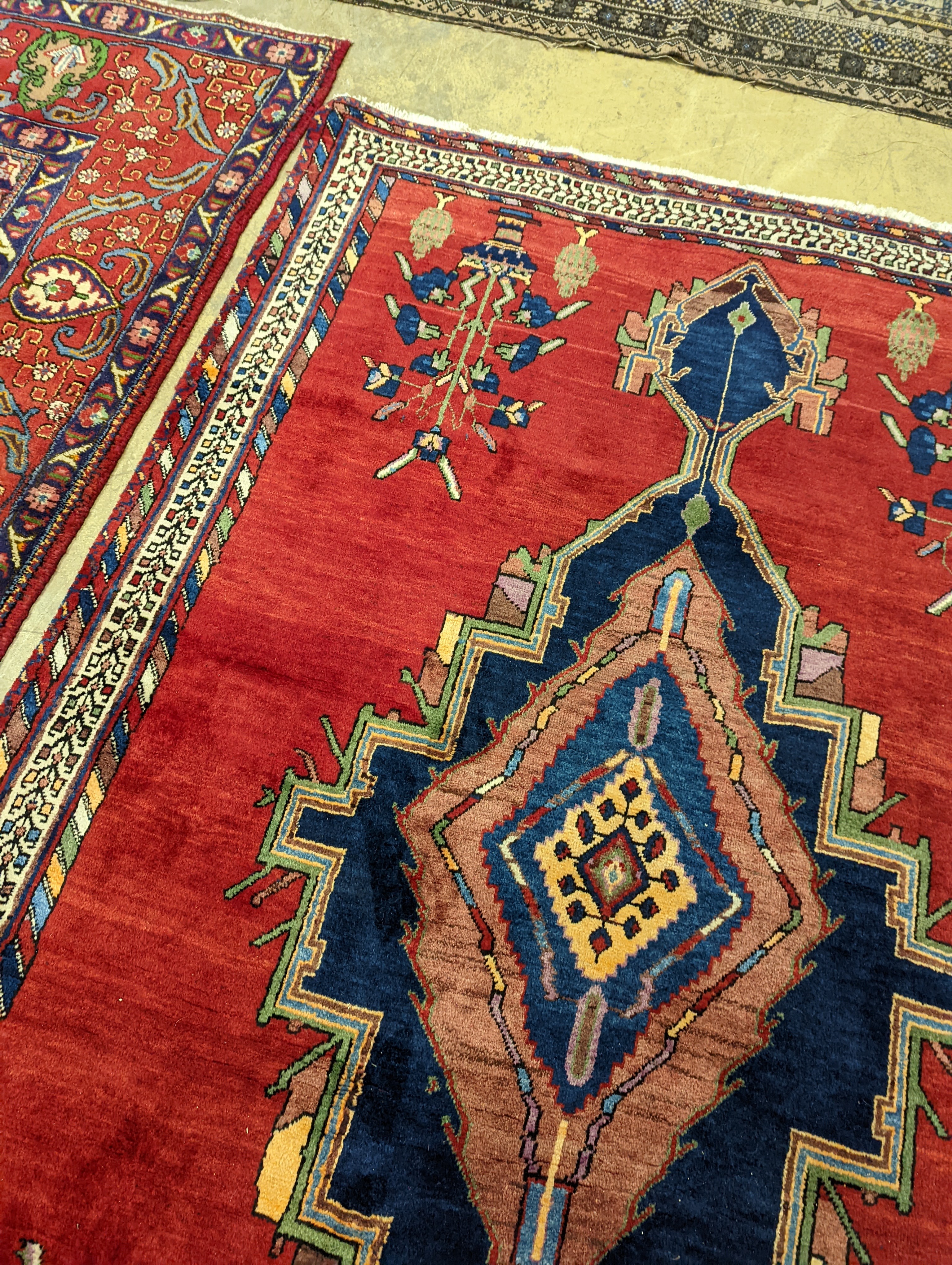 A Caucasian red ground rug, 240 x 168cm